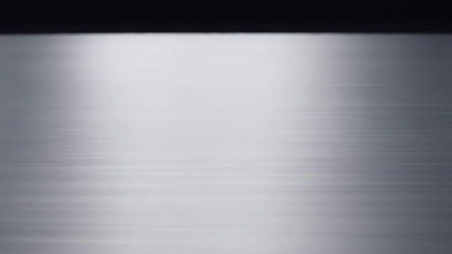 Brushed metal plate texture with light reflections