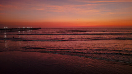 Panoramic aerial drone photo of a beautiful sunset over Pimentel, Chiclayo, northern Peru, a coastal tourism destination for travel and summer vacations