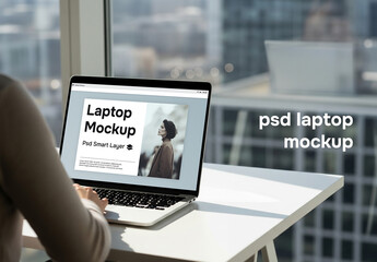 A woman using a laptop - mockup