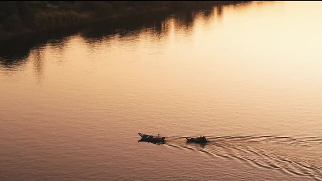 Aerial Drone View of Traditional Boats Sailing on the Nile River at Golden Sunset in Cairo, Egypt