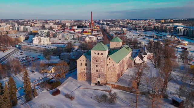 Drone Footage of Turku Castle and City at Sunset