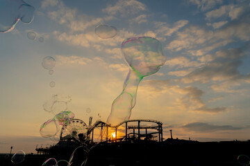 Sunset Magic: Bubbles Dance Over California Pier