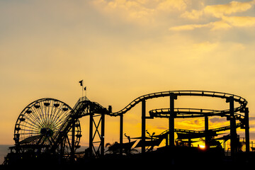 Sunset Silhouette: Roller Coaster Over California Coast