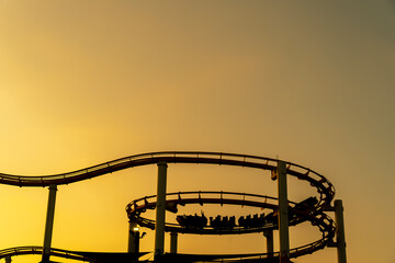Sunset Silhouette: Roller Coaster Over California Coast
