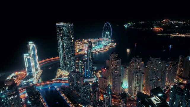 HD Cinematic Night Aerial View of Dubai Marina Skyline and Ain Dubai Ferris Wheel