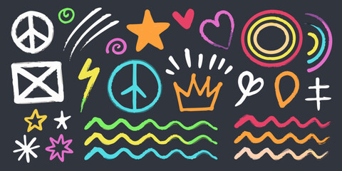 Obraz premium Colorful chalk doodles and symbols on a dark background
