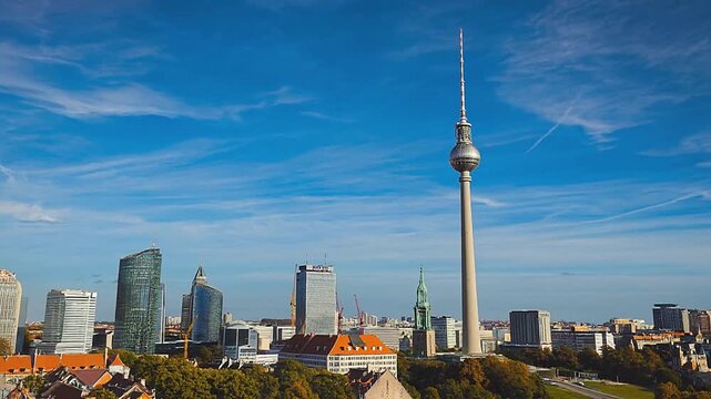 Panoramic view of the Berlin TV Tower (Berliner Fernsehturm) and Alexanderplatz on a sunny day.