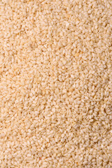 White sesame seeds in a bowl, an ingredient for oil and healthy eating. White sesame