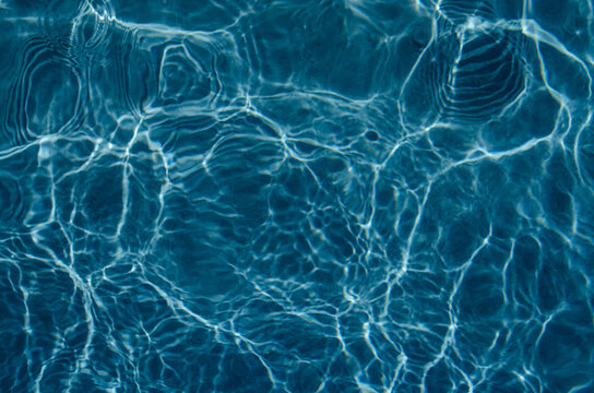 Abstract blue water pattern with waves.