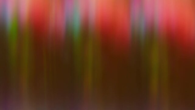 Defocused crystal glow. Reflection ray. Gradient colorful shimmering motion. Red green blue vivid luminosity abstract art background.