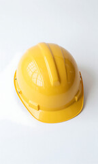 Fototapeta premium bright airy overhead shot lone yellow safety helmet standing upright minimalist white background illuminated soft natural