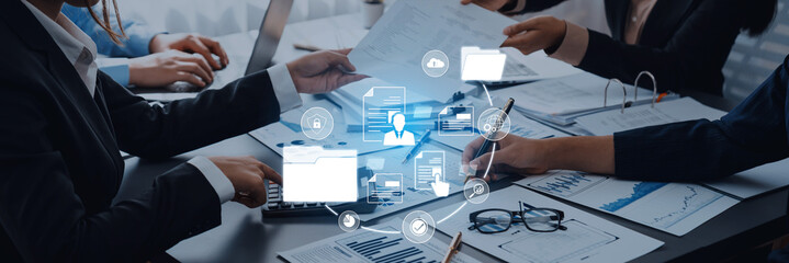 Businesspeople Collaborating in Office with Digital Technology for Data Management and Analysis to...