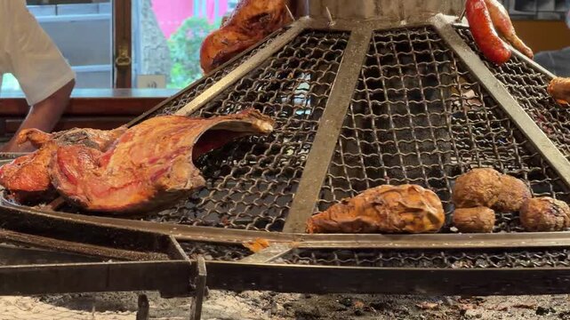 Montevideo Uruguay Spinning Meat Asado BBQ. Uruguayan Barbecue Close Up Hot Food. Metal Grate Seasoned Outdoor Chefs Prepare Delicious Travel Tourism