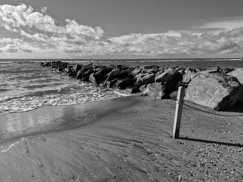 Perspective view of a rock retaining wall to prevent erosion on a stretch of beach in Ostia. The Lido di Ostia, Rome's main seaside resort, is located on the Tyrrhenian Sea.