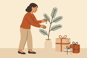 Woman decorates a small tree next to wrapped gifts in a cozy indoor space during the holiday season