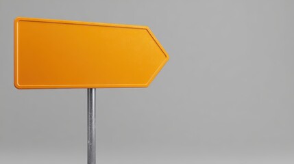 orange road sign arrow on a grey background with copy space, a blank template mockup