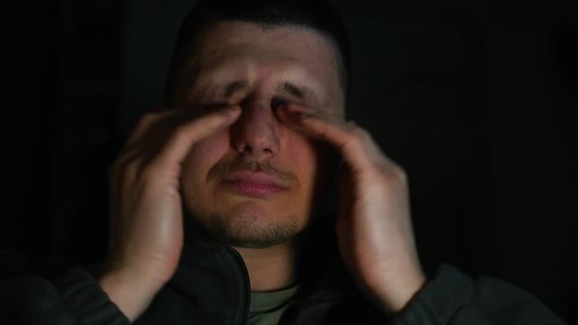 Eye strain.
A sleepy man rubs his eyes with his hands.
Dry eyes.
Eye strain from long hours working on a computer.