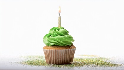 Festive Cupcake With Green Frosting And A Lit Birthday Candle On White