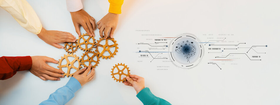 A group of diverse hands collaboratively aligns golden cogs on a light surface, symbolizing teamwork and innovation, alongside futuristic digital elements. Trope