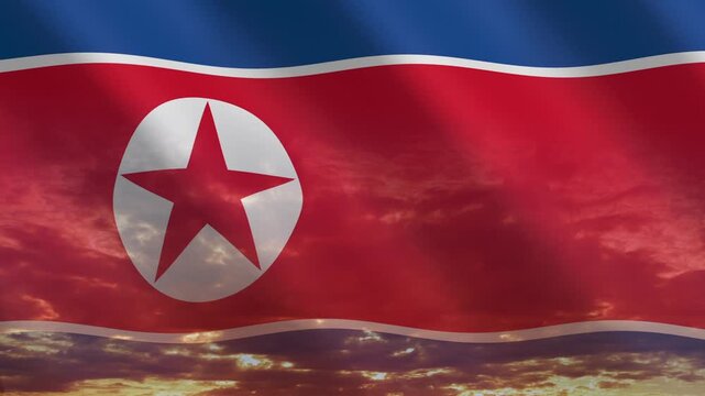 Flag of North Korea waving against a vibrant sunset, creating a patriotic and inspiring atmosphere with warm tones.