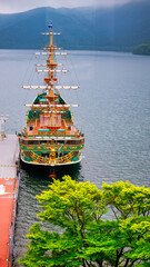 Fototapeta premium Lake Ashi with Hakone sightseeing boat in spring season