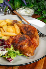 Appetizing baked chicken leg quarter.