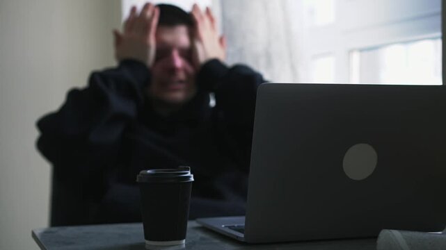 Eye pain due to computer work.
Dry eyes in a man wearing a black hooded sweatshirt.
Watery eyes due to overexertion.