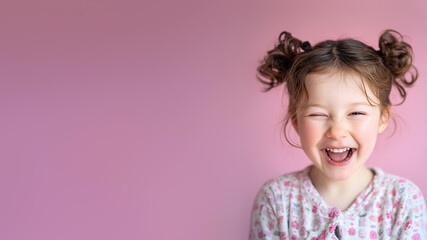 Little girl with pigtails smiling wide brightly, expressing pure joy, emotional freedom, diversity, positive, childhood emotions. Laughing joyfully happy child portrait. Pink background. Copy space.