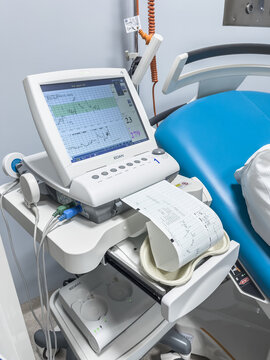 Krotoszyn, poland - 20 01 2026: Short description: Modern KTG fetal monitor placed on a medical cart in the delivery room