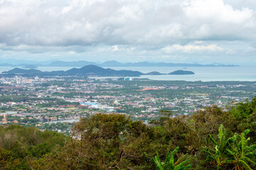 Aerial view from Big Buddha on Coast of Phuket Island in Thailand. Beautiful landscape Jungle and turquoise blue water of Andaman Sea 