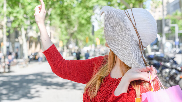 Happy blonde girl visiting city