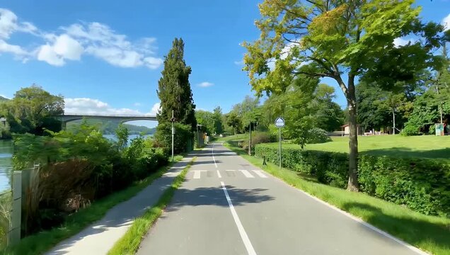 High resolution 4K footage of scenic bike path between Sarzana Santo Stefano following the Lunense channel highlighting smooth terrain greenery outdoor adventure stock 
