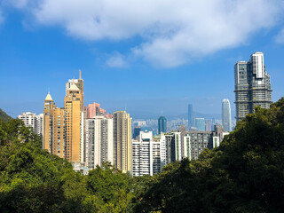 The Peak Tower in Hong Kong at the Victoria Peak Park. Hong Kong Skyline with Victoria Harbour and...