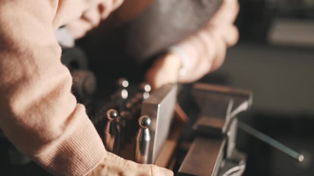 Jeweler selecting a dapping punch tool