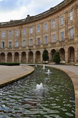 Buxton Crescent, iconic Georgian curved terrace and historic spa landmark in Buxton, Peak District, Derbyshire  elegant classical architecture with curved fountain pond, heritage travel destination UK © Cissa King