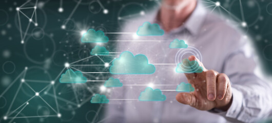 Fototapeta premium Man touching a cloud networking concept