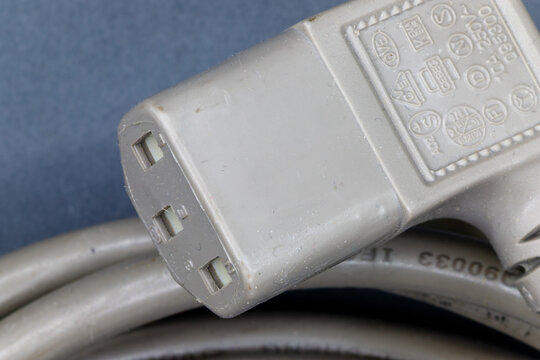 Close up view of a three-pin iec c13 power cable connector
