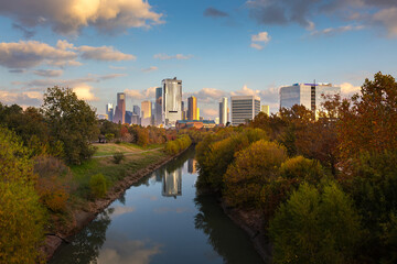 Obraz premium Houston Downtown modern business city with skyscraper city scape with park view from Buffalo Bayou center of Houston city, Texas, United States of America, US at sunset time stock photo