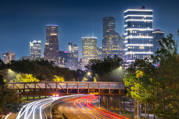 Houston Downtown modern business city with skyscraper and highway transportation city scape with Buffalo Bayou park in Houston city, Texas, United States of America, USA at night after sunset time