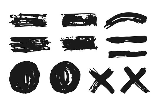A set of black brush strokes with various rough shapes and textures. Abstract doodle-style graphic elements for design work and creative projects.