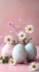 Fototapeta premium three pastel polka dot eggs nestled among white daisies and small pink blossoms on a soft pink background, evoking gentle springtime joy