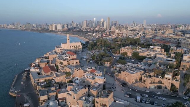 Aerial view of Old Jaffa port and Tel Aviv skyline at sunset, Mediterranean sea coast, Israel