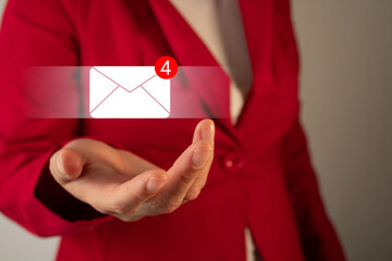 Businesswoman holding an email icon
