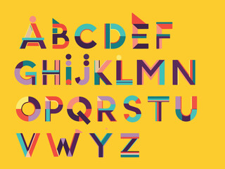 A vibrant geometric alphabet design displayed in four rows on a yellow background © charly