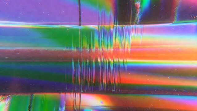 Abstract vertical light glitch background with blue and gold prismatic reflections