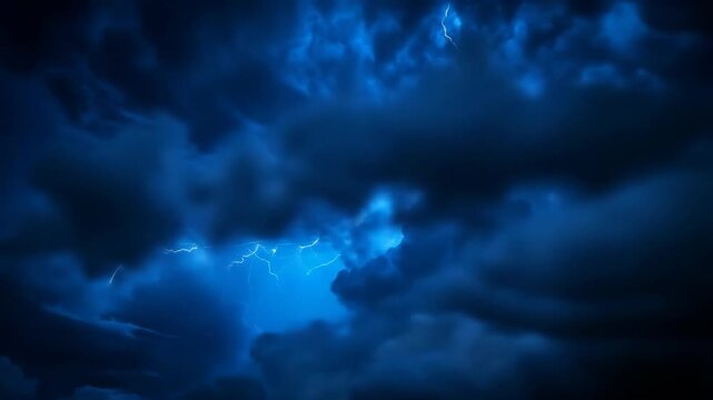Dramatic storm clouds with lightning flashes across a dark sky