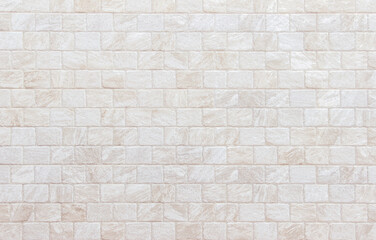 Obraz premium Detail of modern cream brick wall background photo. White light brick wall texture background for stone tile block painted in beige light color wallpaper modern interior and exterior backdrop design.