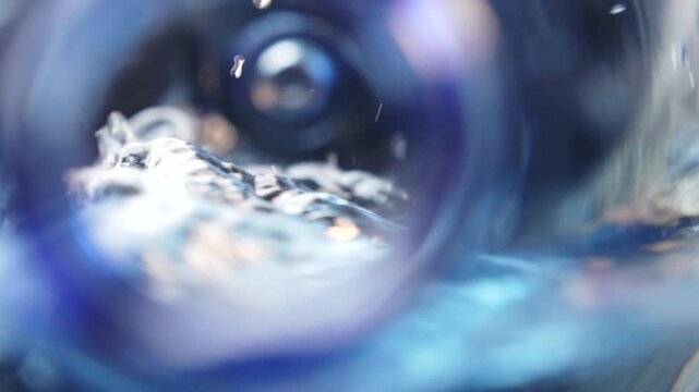 Side to side moving water macro abstract view inside a plastic water jug. Flowing liquid motion, wave movement, soft blur, depth, clean hydration and modern fluid background.