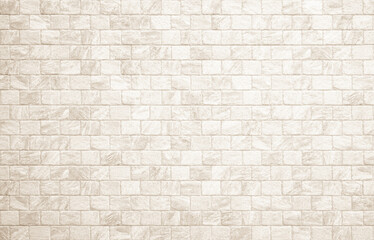Fototapeta premium Detail of modern cream brick wall background photo. White light brick wall texture background for stone tile block painted in beige light color wallpaper modern interior and exterior backdrop design.