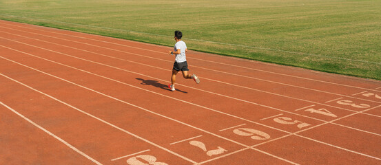 Fototapeta premium Solo runner sprints on an empty track pushing limits in solitary pursuit of athletic goals